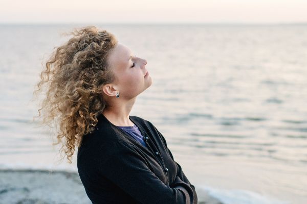 Taking in sea air woman
