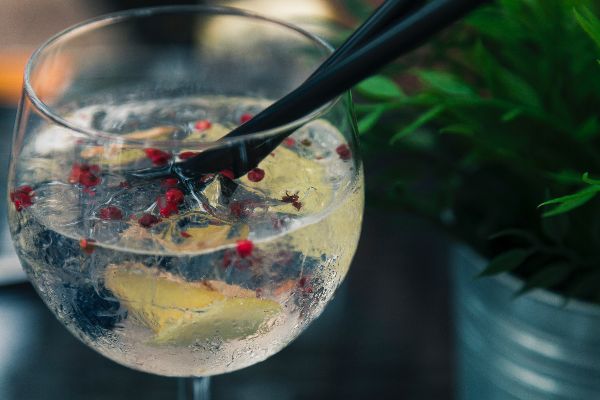 clear-wine-glass-with-liquid-in-focus-photography-1170599